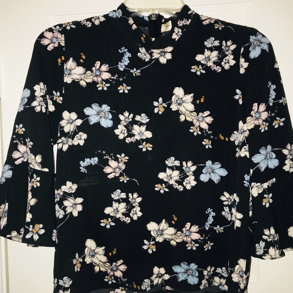 Blouse. Flirty. Black w/flowers. High neck.